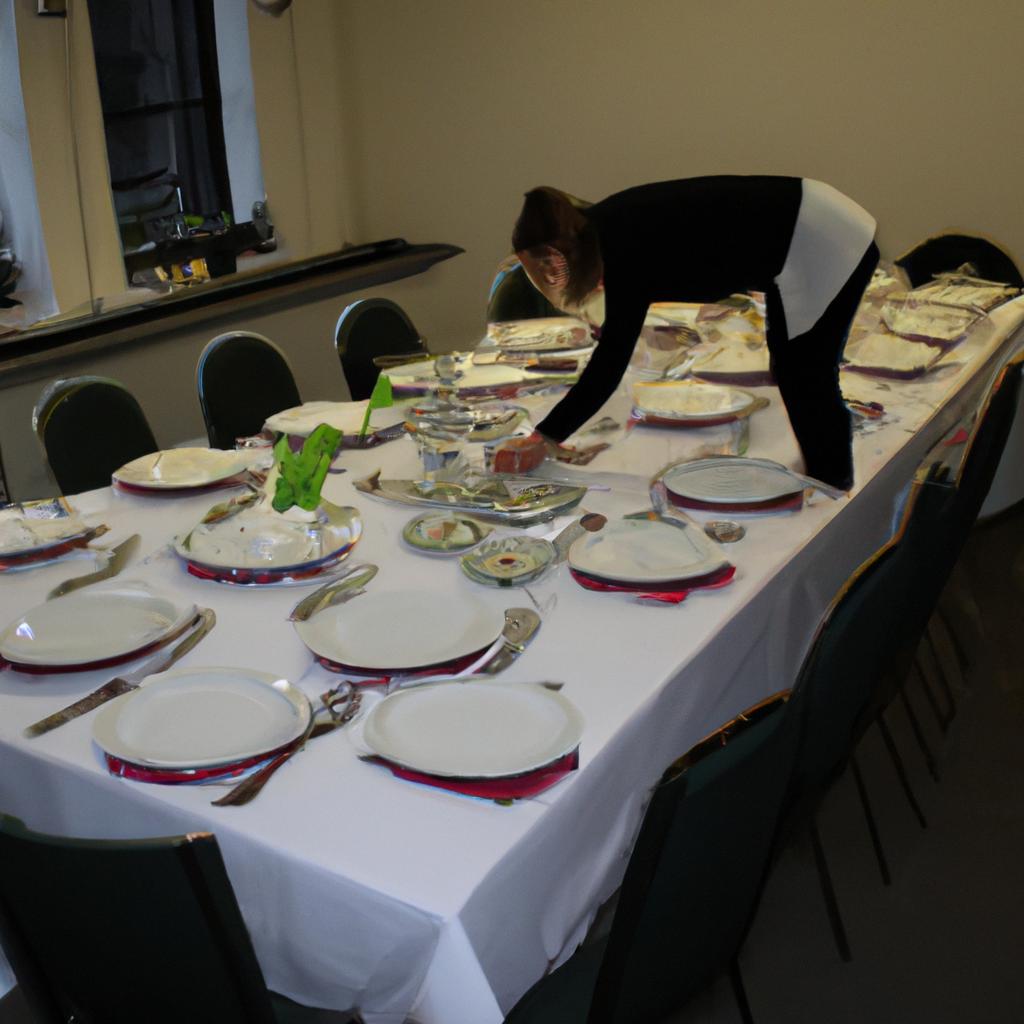 Person setting up banquet tables